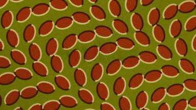 Pattern Of Reddish Leaf Shapes On Olive Green Background Twirls Around
