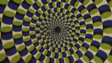 Clockwise Rotating Pattern Comprised Of Repeating Cylindrical Shapes Ending In A