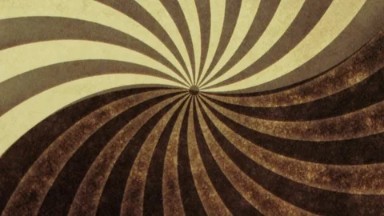 An Image Of An Optical Illusion With Dark Brown And White Swirly Lines As It Spins Clockwise