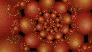 Orange Circular Pattern With Black Background Twirling On Screen Small Accents