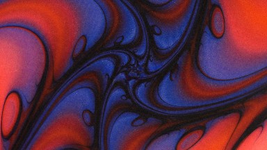 Close Up Rotating Purple And Orange Kaleidoscope Design