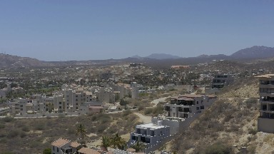LOS CABOS MEXICO-2019: Abandoned Homes on Ugly Hills in Arid Landscape