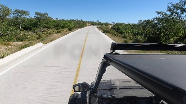LOS CABOS MEXICO-2019: Nice Sunny Day Driving In A SUV Down A Highway With Green