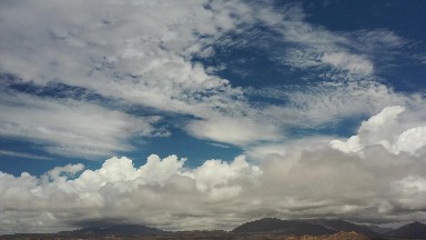LOS CABOS MEXICO-2020: White Clouds Blue Sky Fluffy Clouds Mountains Calm Hills