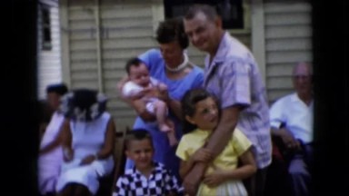 1969: California. A Family Poses For A Picture In Front Of Their House.