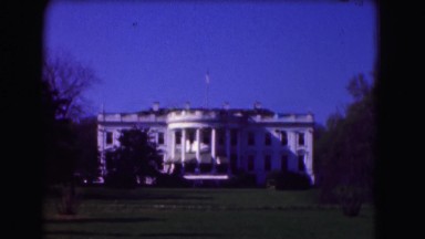 1946: Washington DC Visit. Two People Walking Down A Street At Night.