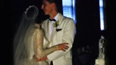 1964: Camden New Jersey Usa. A Bride And Groom Standing In Front Of A Wedding