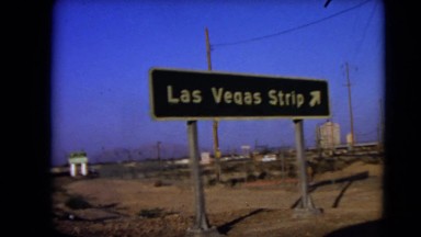 1966: Las Vegas Nevada. A Green Street Sign Sitting On The Side Of A Road.