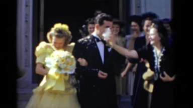1943: Bridgeport, Connecticut Wedding. A Woman In A Yellow Dress And A Man In A Suit