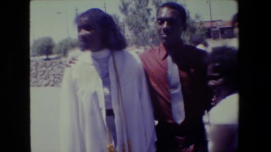 1983: Lansing Michigan. A Couple Of People Standing Next To Each Other.