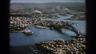 1967: Sydney, Australia. An Aerial View Of A City With A Bridge.