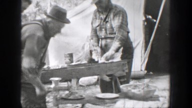 1939: Chelan, Washington. A Couple Of Men Standing Next To Each Other.