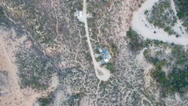 CABO PULMO BCS MEXICO-2023: An Aerial View Of A House In The Middle Of A Field