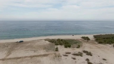 LOS BARRILES EAST CAPE BCS MEXICO-2023: A Truck Parked On Top Of A Sandy Beach