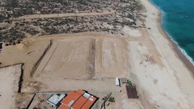 LA FORTUNA EAST CAPE BCS MEXICO-2023: An Aerial View Of A Beach With A Lot Of Construction And Natural Beauty