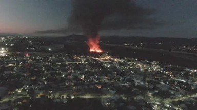 SAN JOSE DEL CABO BCS MEXICO-2023: Aerial View Of A City At Night With Fire And Smoke