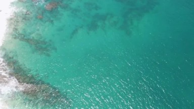 BUZZARDS BEACH EAST CAPE BCS MEXICO-2023: An Aerial View Of A Body Of Water
