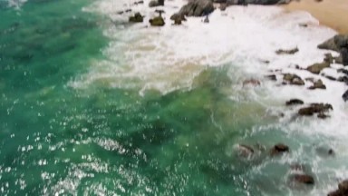 BUZZARDS BEACH EAST CAPE BCS MEXICO-2023: A Bird's Eye View Of A Body Of Water