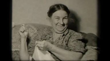 1942: Sebring, Ohio. USA. Woman Holding a Cat and a Towel