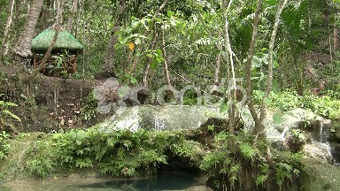 Spend Under Hut Besides Waterfall