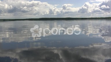 Boating Across Glassy Lake Waters
