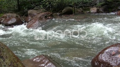 Overflowing Water into Boulders