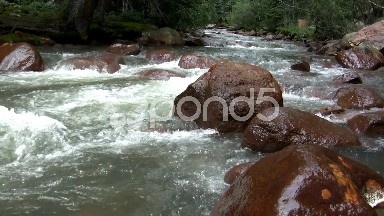 (Seamless Loop) Flowing Water Over Big Boulders