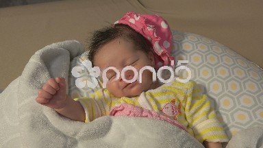 Newborn Baby Smiling In Her Sleep