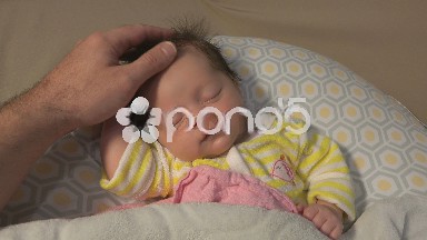Father Caring for Newborn Baby