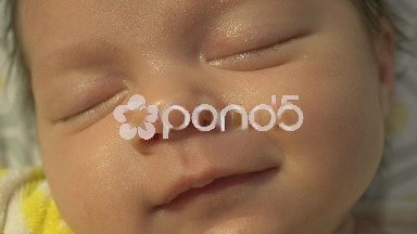 Newborn Baby Smiling While Sleep Closeup