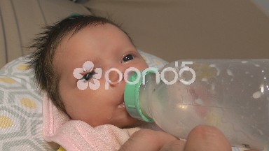 Newborn Baby With Bottle Closeup