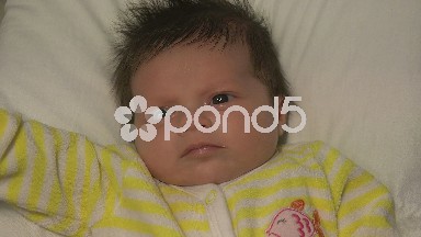 Baby In Yellow Jumper