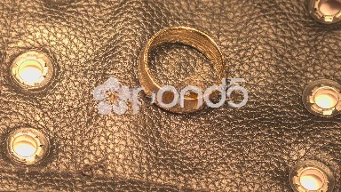 Gold Ring on Black Leather