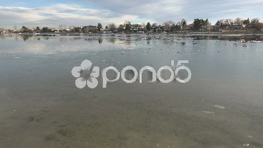 Pan of Dangerous and Very Thin Ice on Lake