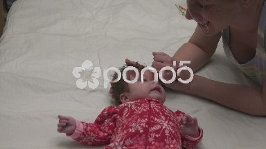 Mother and Baby in Christmas Garb