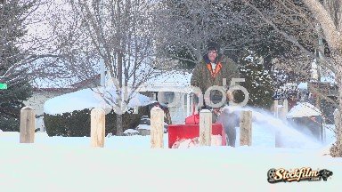 Denver, Colorado: Man Snowblowing The Sidewalk