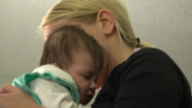 WESTMINSTER, COLORADO, UNITED STATES-2015: Baby Swaddled to Calm