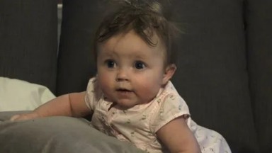 WESTMINSTER, COLORADO, UNITED STATES-2015: Baby Sitting Up, Falling Down