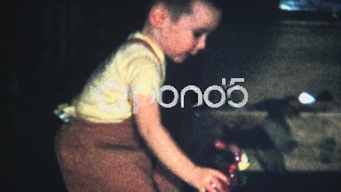 (8mm Vintage) Christmas 1957 Kid Plays With Bunny Toy