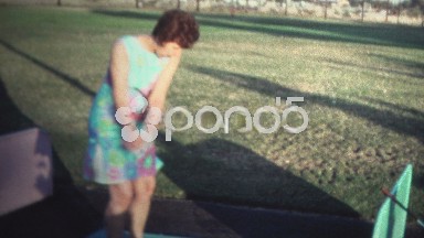 (8mm Vintage) 1971 Women in Dress At Driving Range