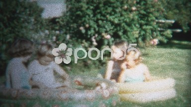 (8mm Vintage) 1954 Girls Playing Outside Small Splash Pools. Iowa, USA.