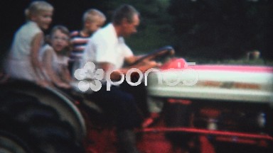 (8mm Vintage) 1954 Dad Letting Daughter Drive Family Farm Tractor. Iowa, USA.