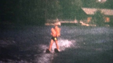 (8mm Vintage) 1966 Child Waterskiing On Lake