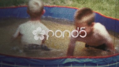 1957 - Boys Playing In Small Splash Pool