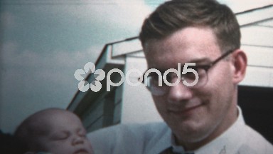1958 - New Dad Holding Baby Versus Grandpa Holding Baby