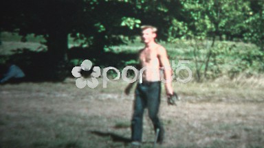 1958 - Shirtless Man Tossing Horseshoe Practice Game