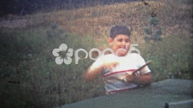 1953: A Child Trying to Play the New Popular Sport, Ping Pong!