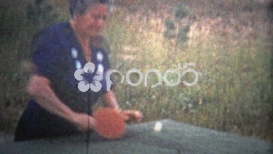 1953: Old Woman Practicing Table Tennis in Grainy 8mm Footage