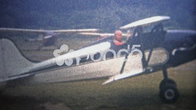 1954: Classic biplane taxiing across Zahn's airfield.
