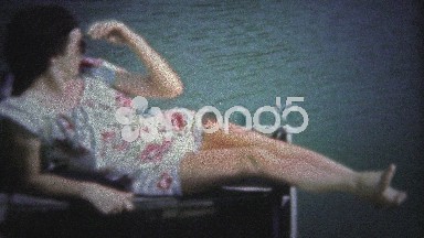 Georgia, USA. - 1946: Happy Sunbathers Enjoy a Hot Summer Day at the Lake.
